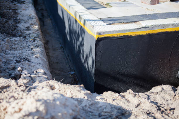 Professional Exterior Waterproofing technician working in North Bend, OR